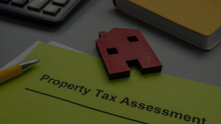 Red house cut-out on a folder labelled Property Tax Assessment