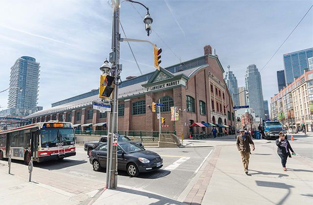 The St. Lawrence Market building with a TTC bus passing